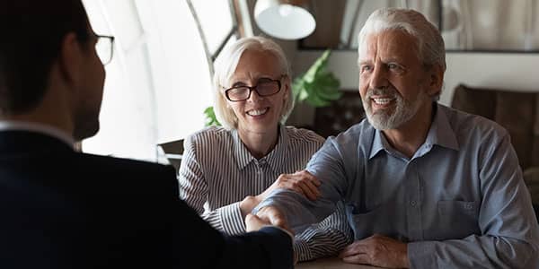 Old couple discussing claim management