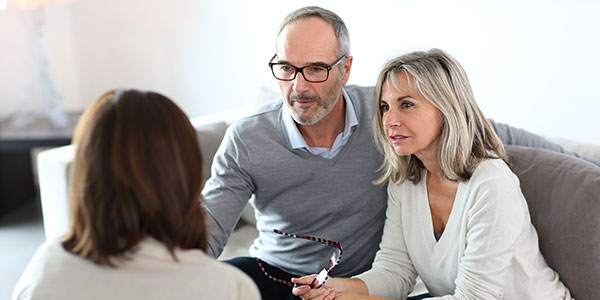 Married couple in Wrexham meeting with advisor