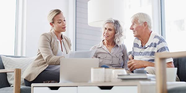 Elderly couple looking at laptop